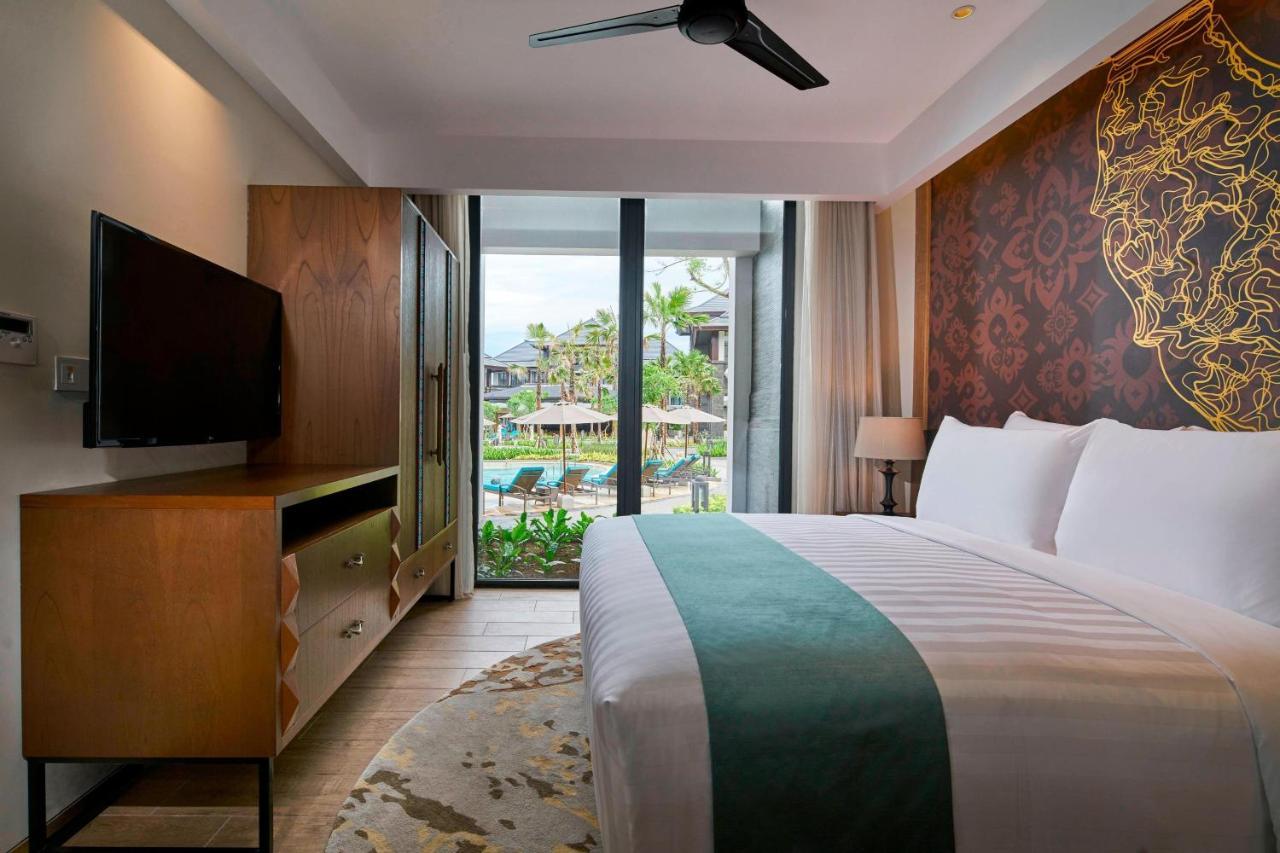 One Bedroom apartment with king bed, a sofa and balcony
