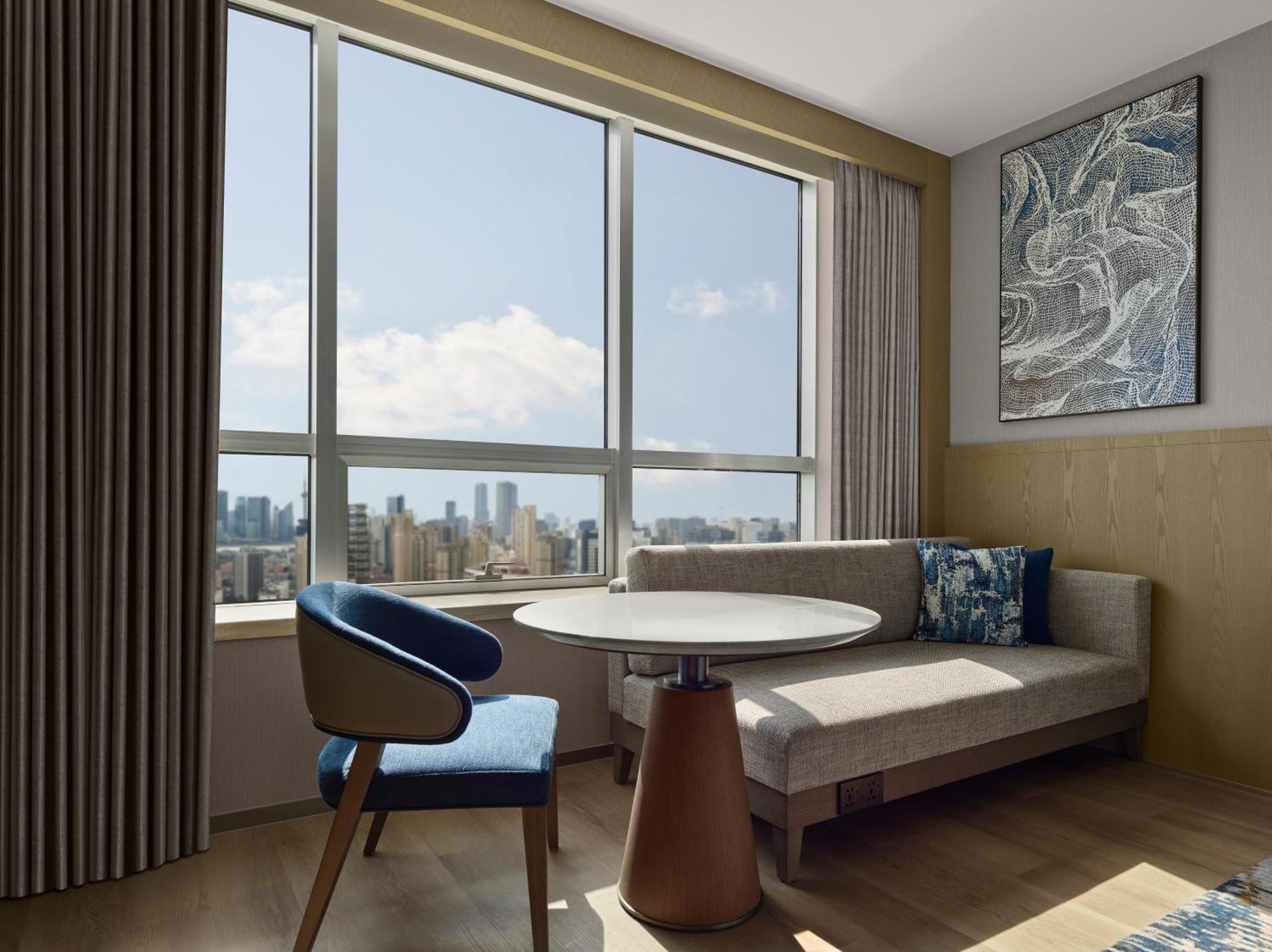 Family Room with Two Double Beds and One Twin Bed and City View