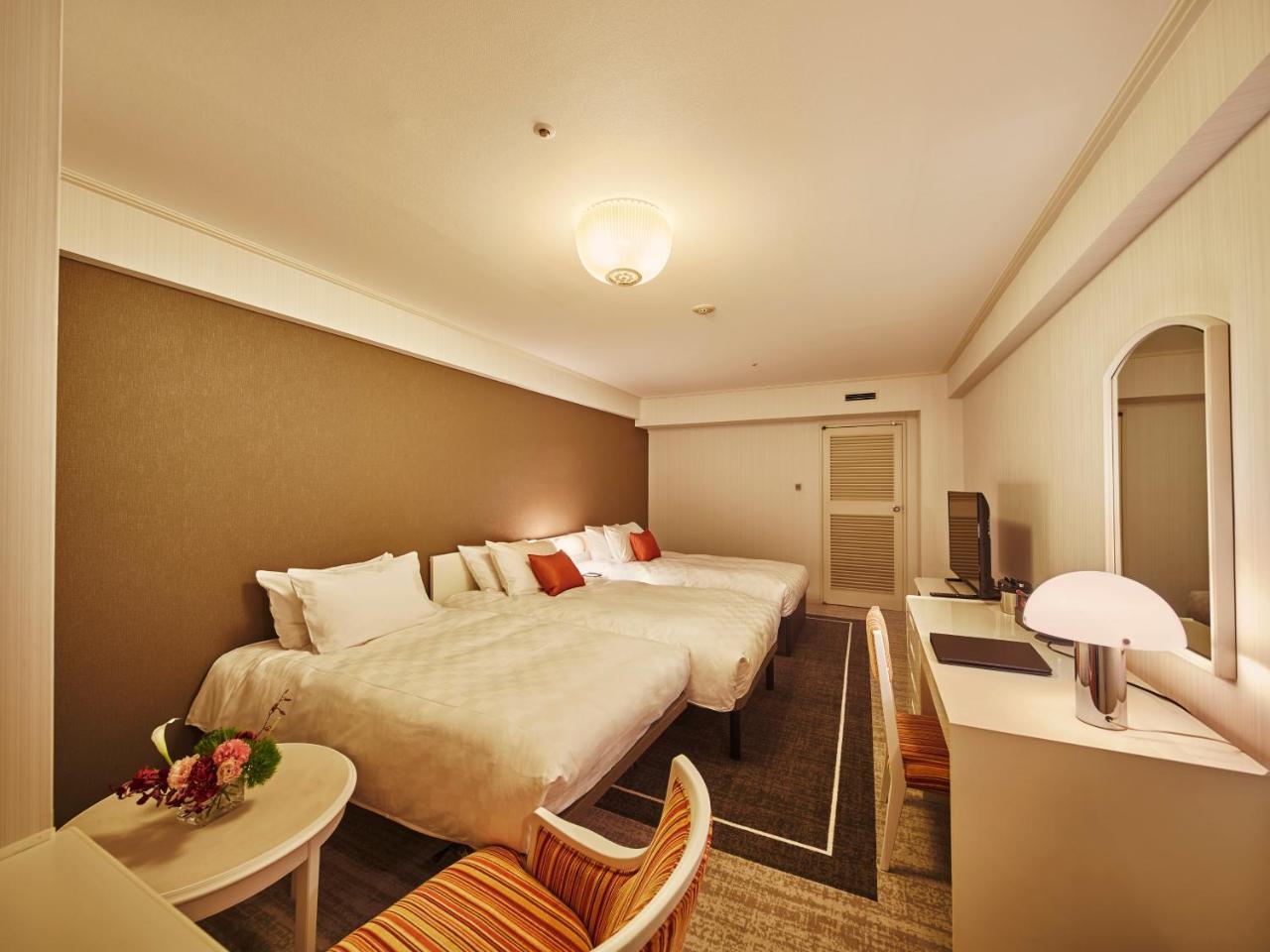 Quarto Twin Deluxe com Cama Extra - Não Fumador
