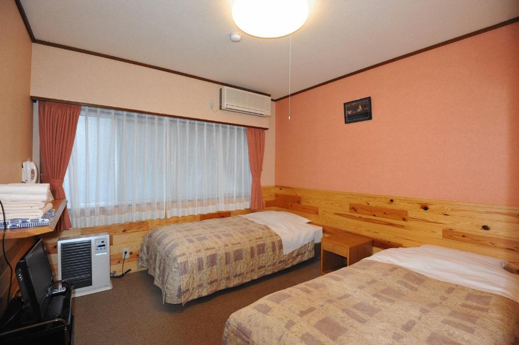 Chambre Lits Jumeaux avec Salle de Bains Privative